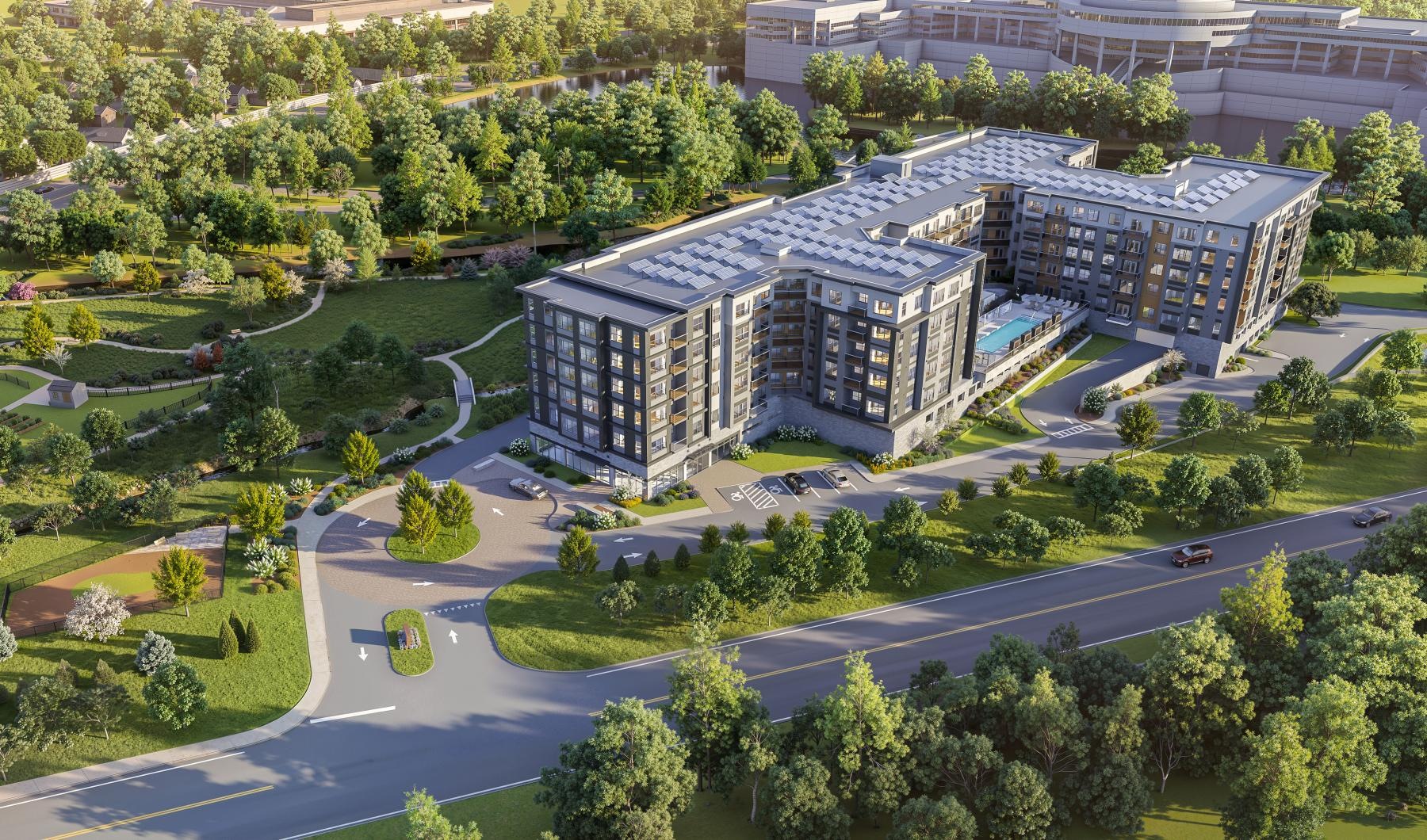 an aerial view of an apartment complex with trees