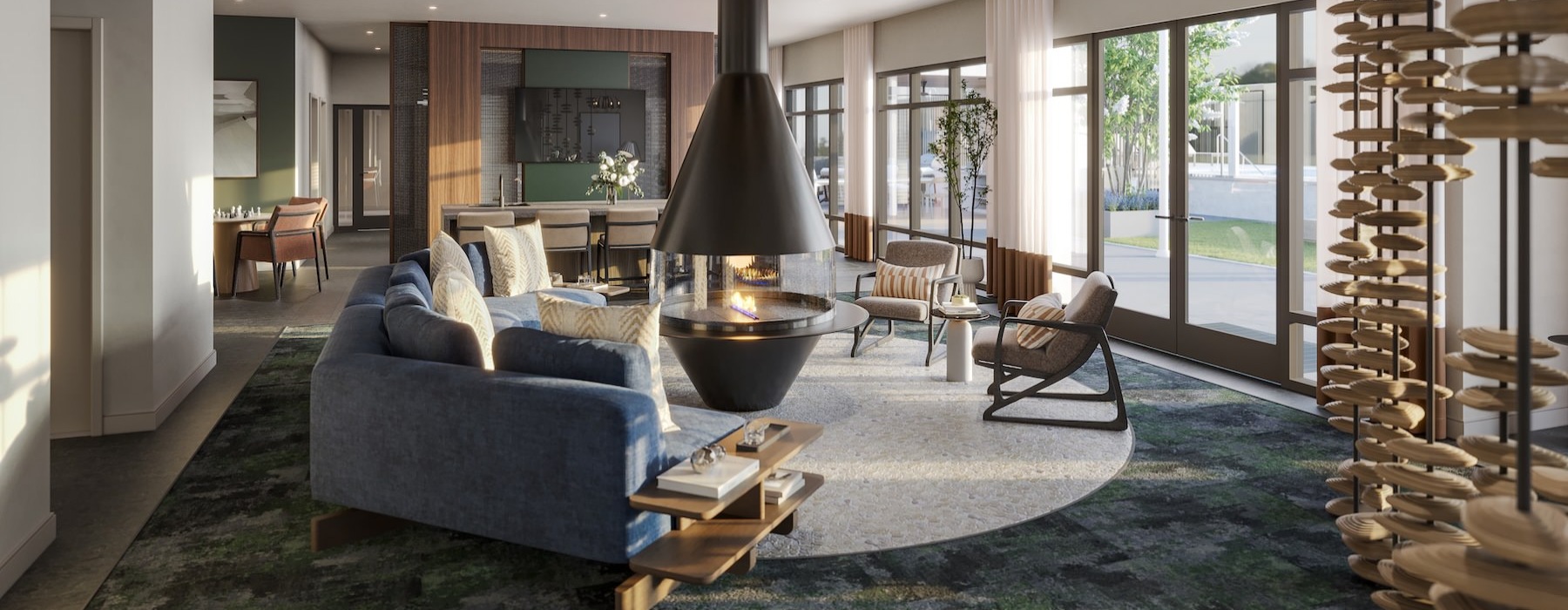 a lounge with a couch, chairs and a fireplace