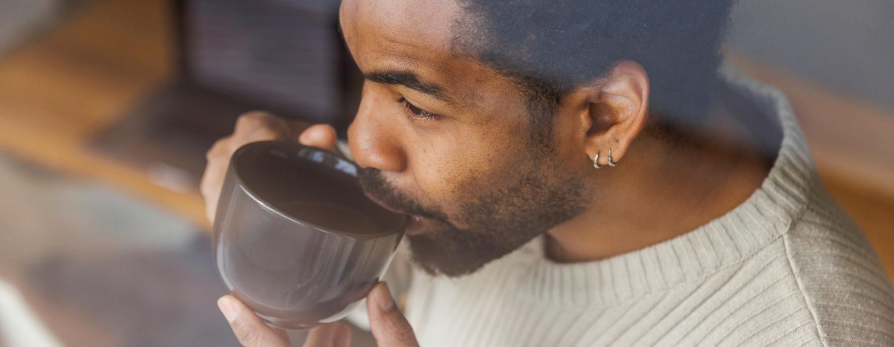 a person drinking from a cup