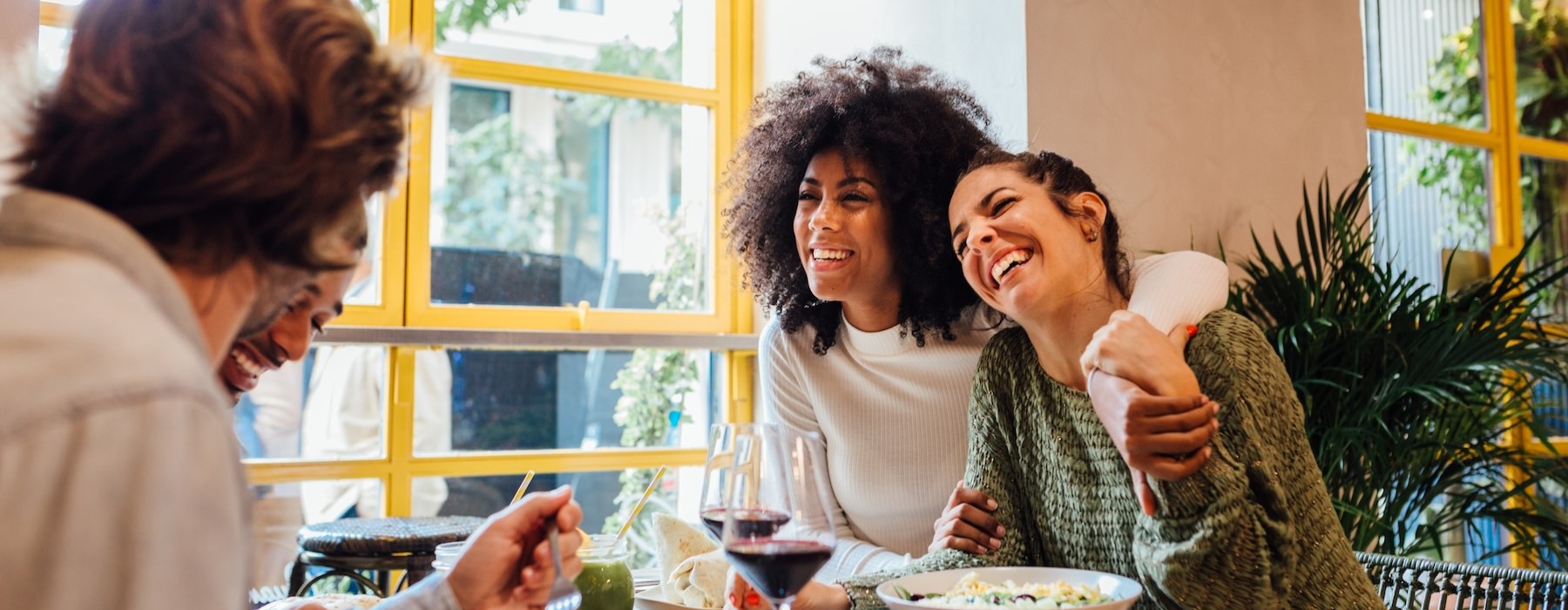 a group of women eating at a table